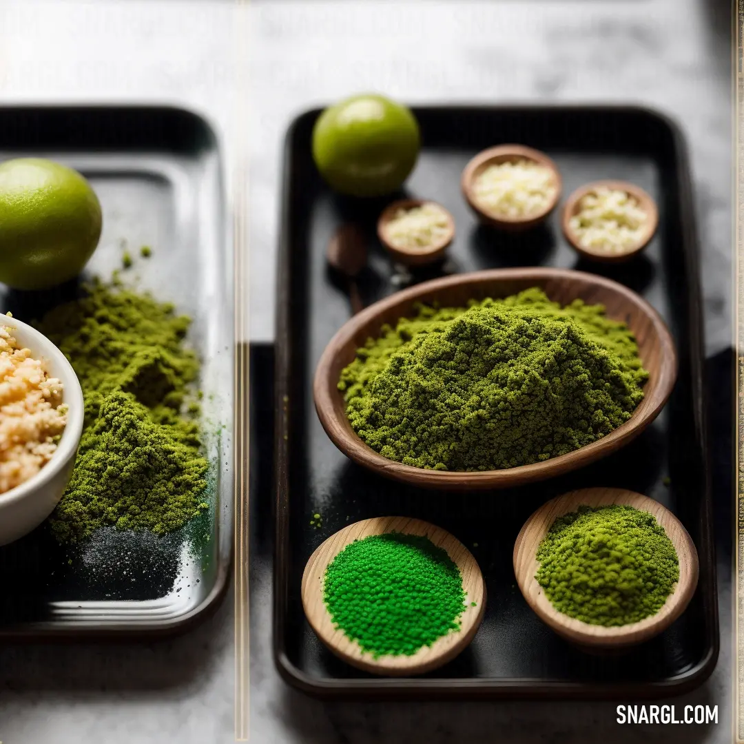 Tray with bowls of food and a bowl of green powder on it with limes in the background