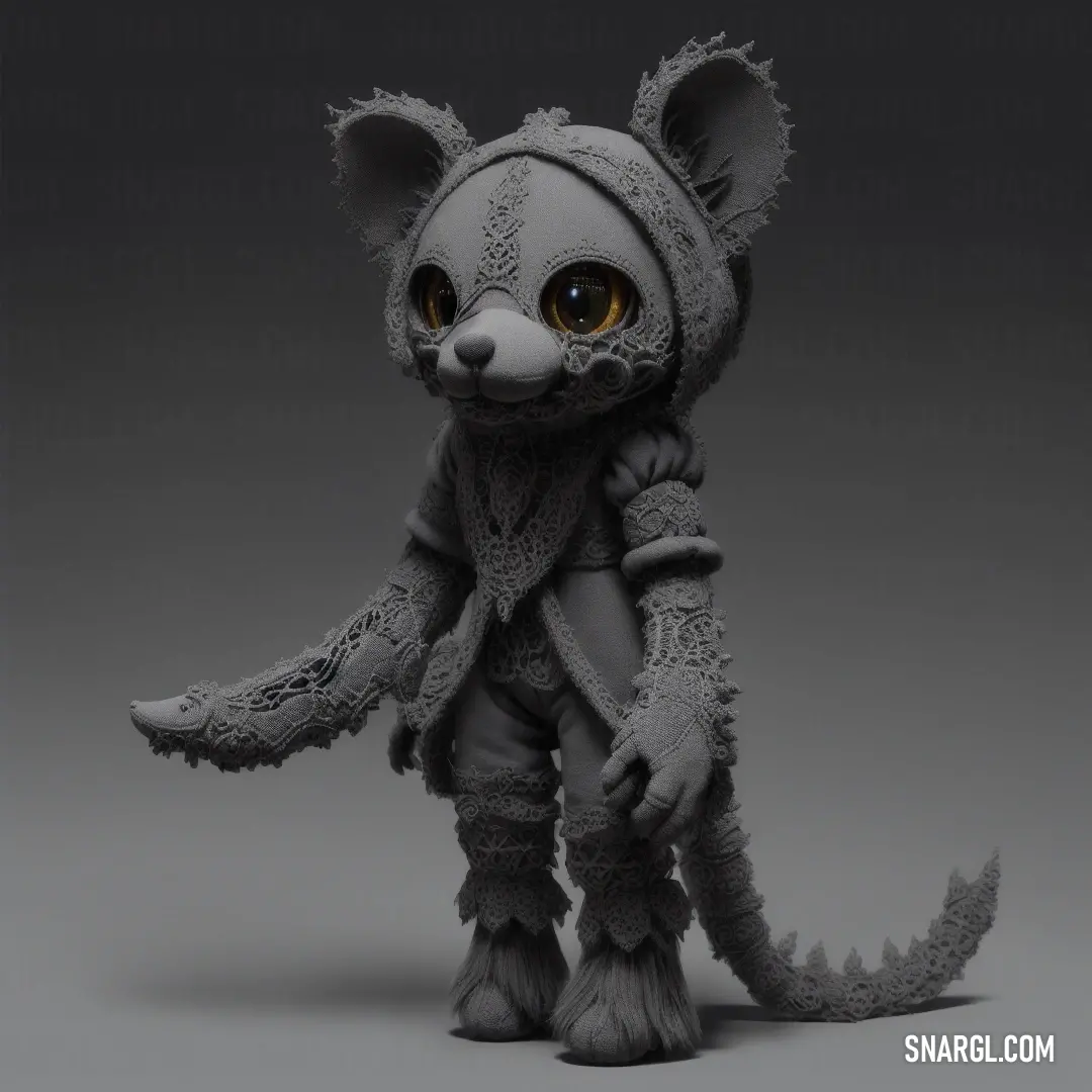 Small toy animal with big eyes and a furry tail