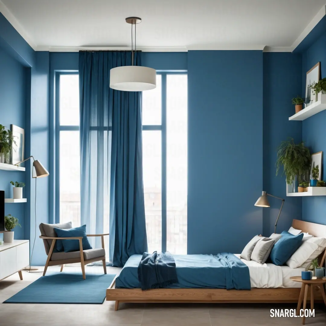 Bedroom with blue walls and a bed with a blue blanket on it and a chair and a table. Color RGB 54,117,136.