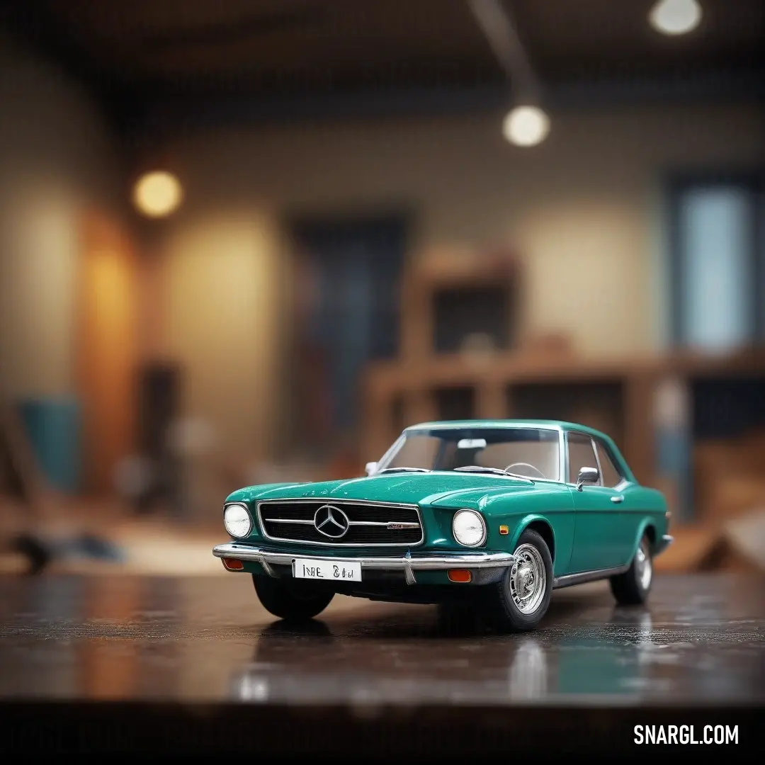 Toy car is on a table in a room with a wooden floor and a large window in the background. Example of CMYK 100,0,17,57 color.