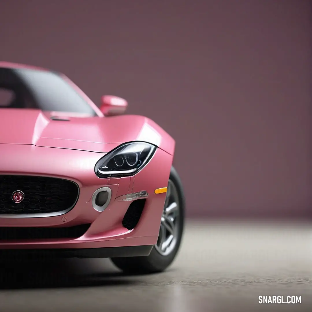 Pink car is shown in a studio photo with a soft background. Example of RGB 252,137,172 color.
