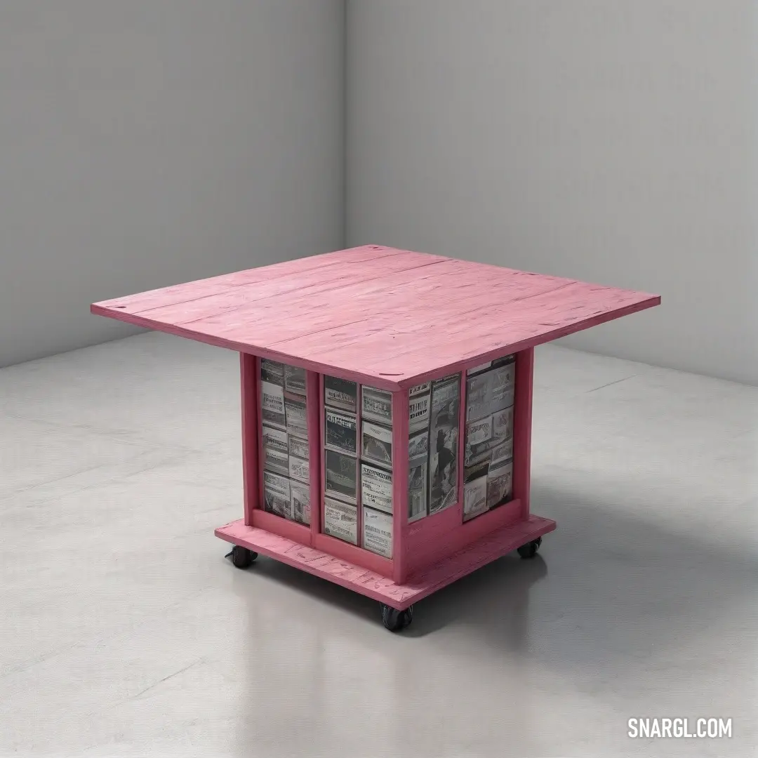 Pink table with a bunch of newspapers on it's sides and a shelf on the top of it. Color CMYK 0,46,32,1.