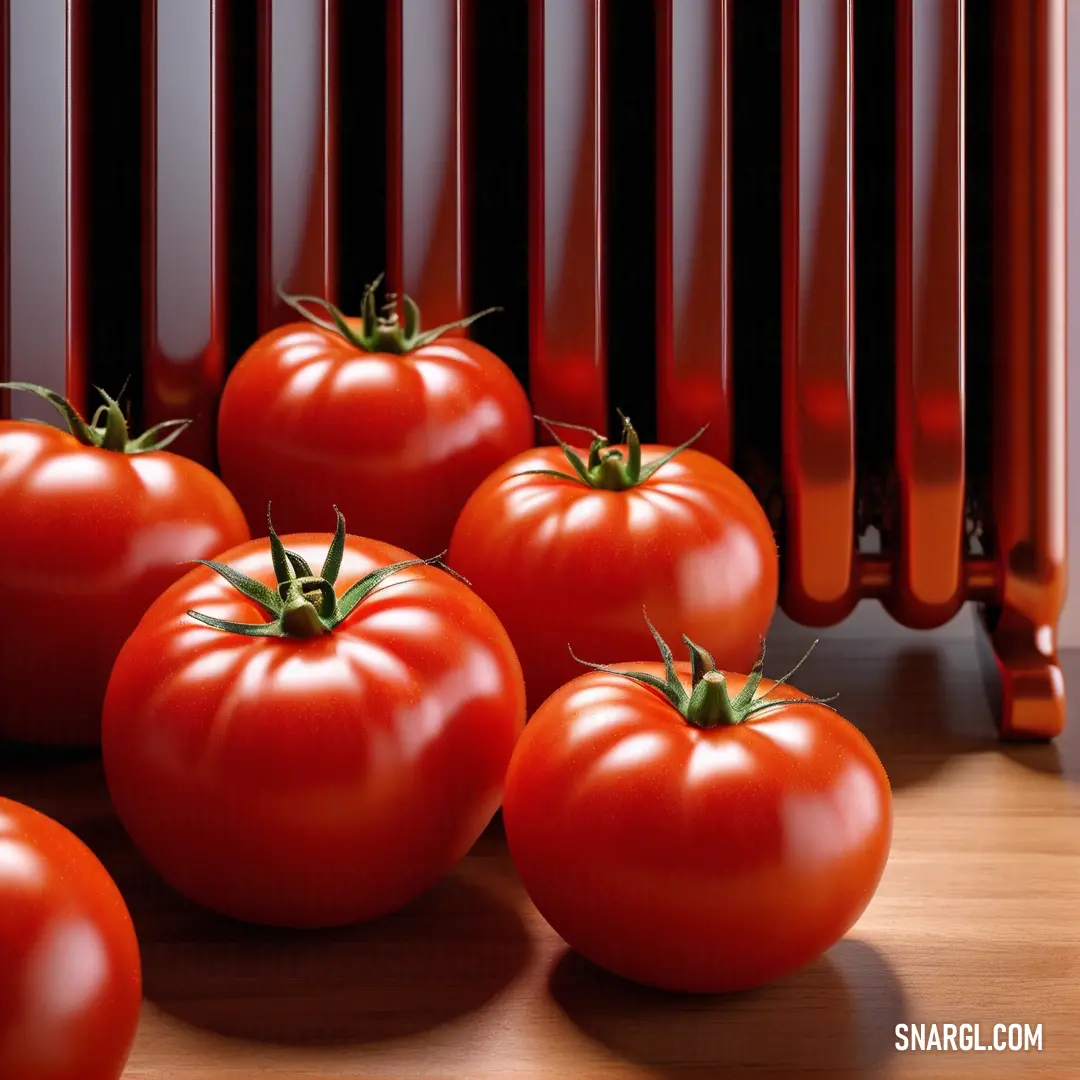 Group of tomatoes on top of a wooden table next to a radiator. Color Tomato.