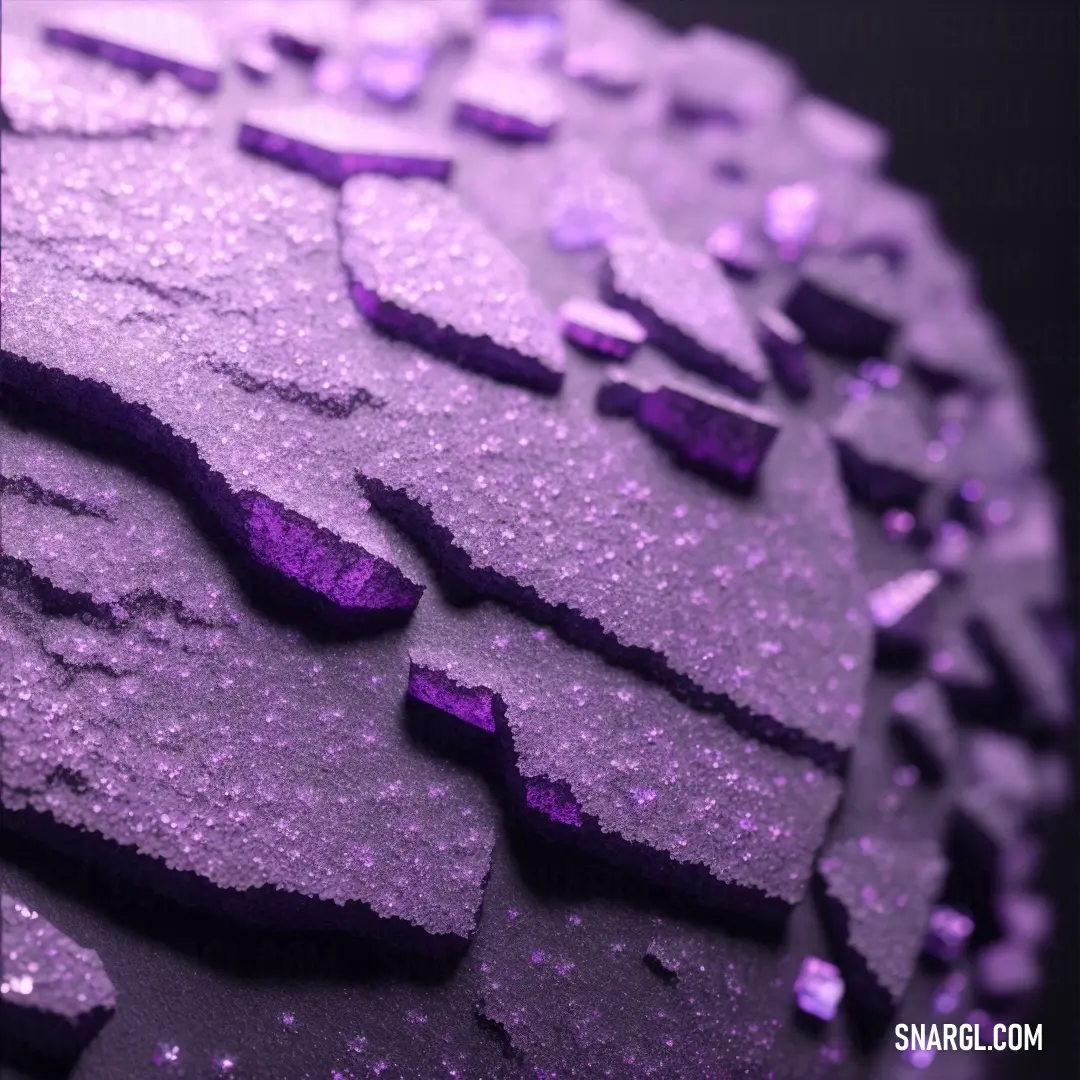Close up of a purple surface with small bubbles of water on it and a black background