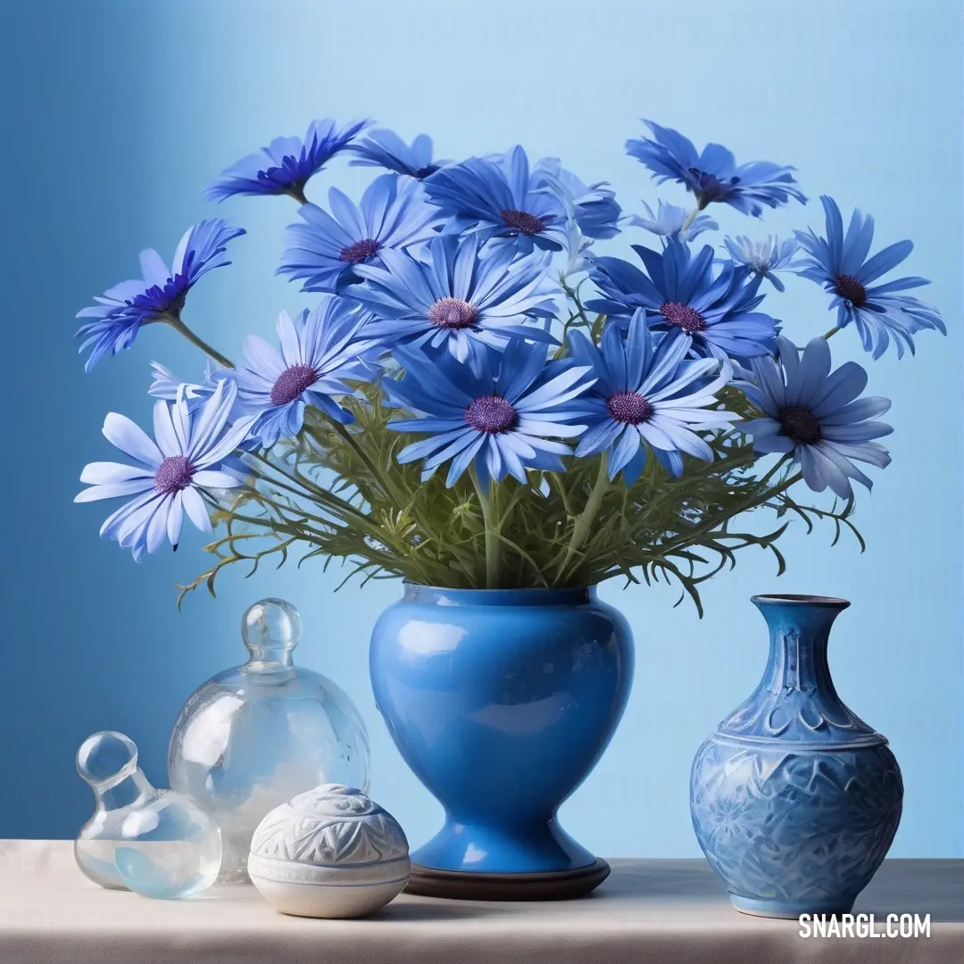 Blue vase with blue flowers in it and a few other vases. Example of #417DC1 color.