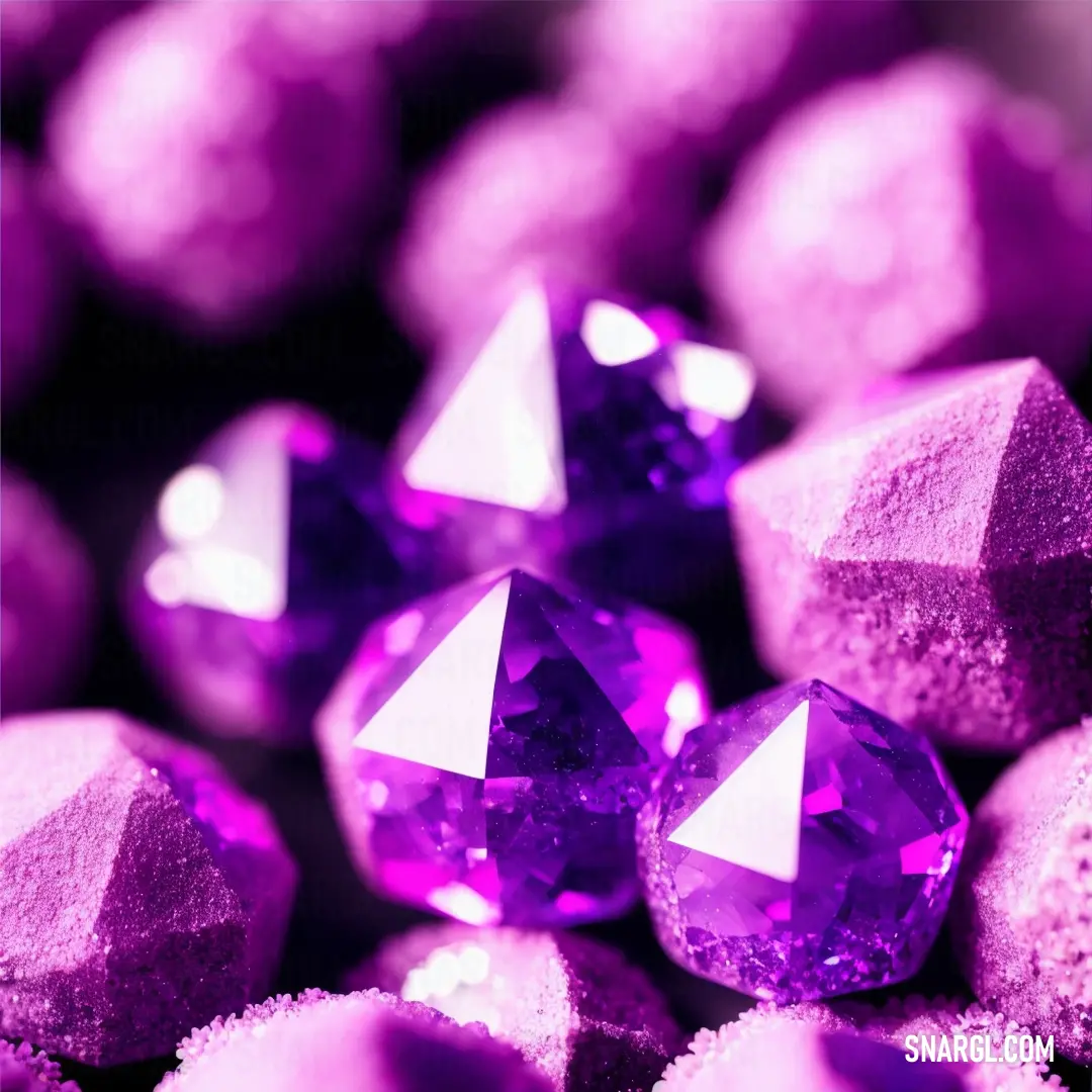 Close up of a bunch of purple crystals with white dots on them and a black background