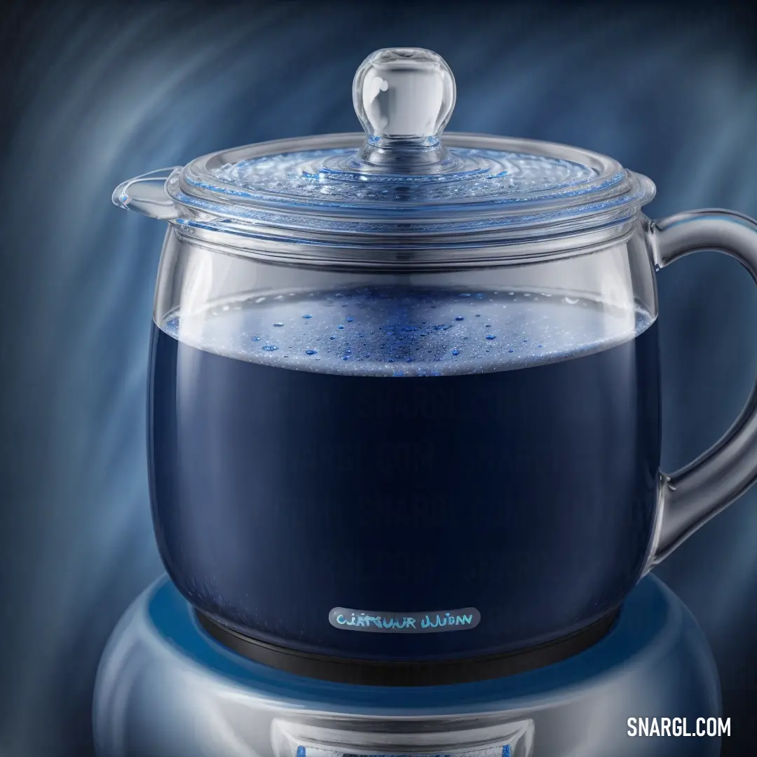 Blue coffee pot with a lid and a glass cup on top of it with a liquid inside of it