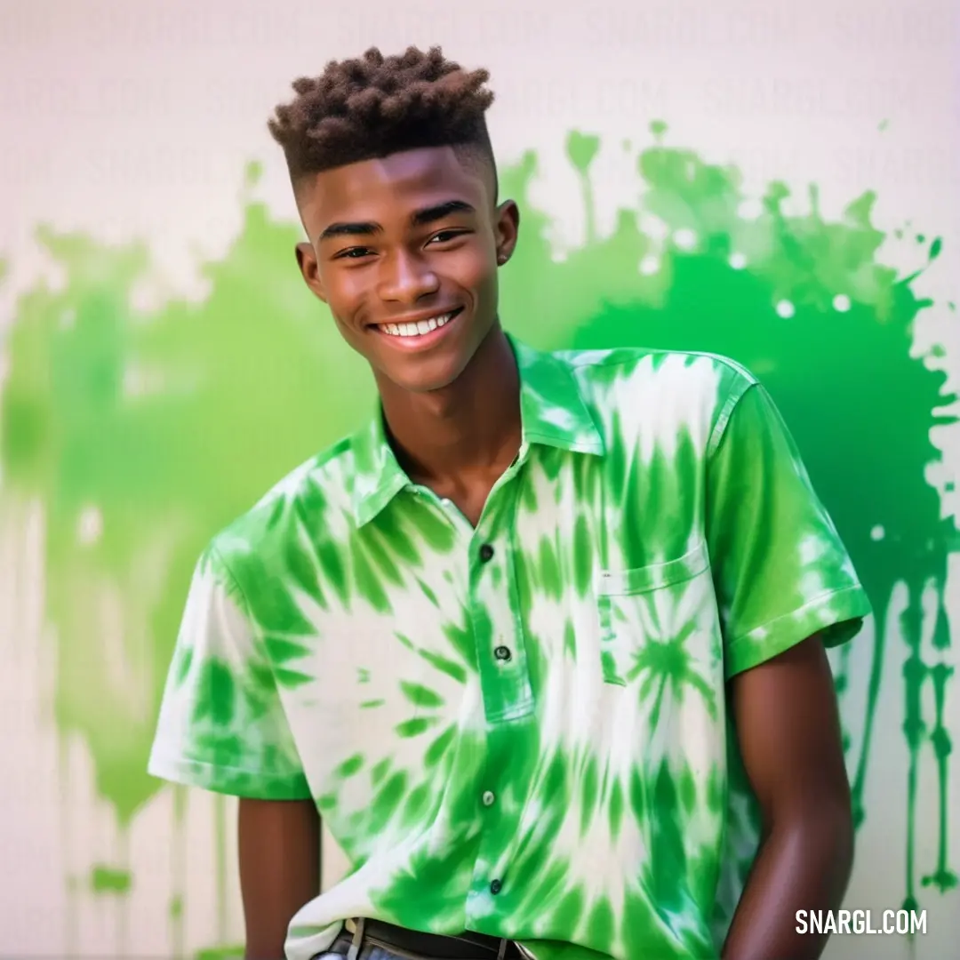 Young man with a green shirt and a white shirt on smiling at the camera. Example of RGB 60,208,112 color.