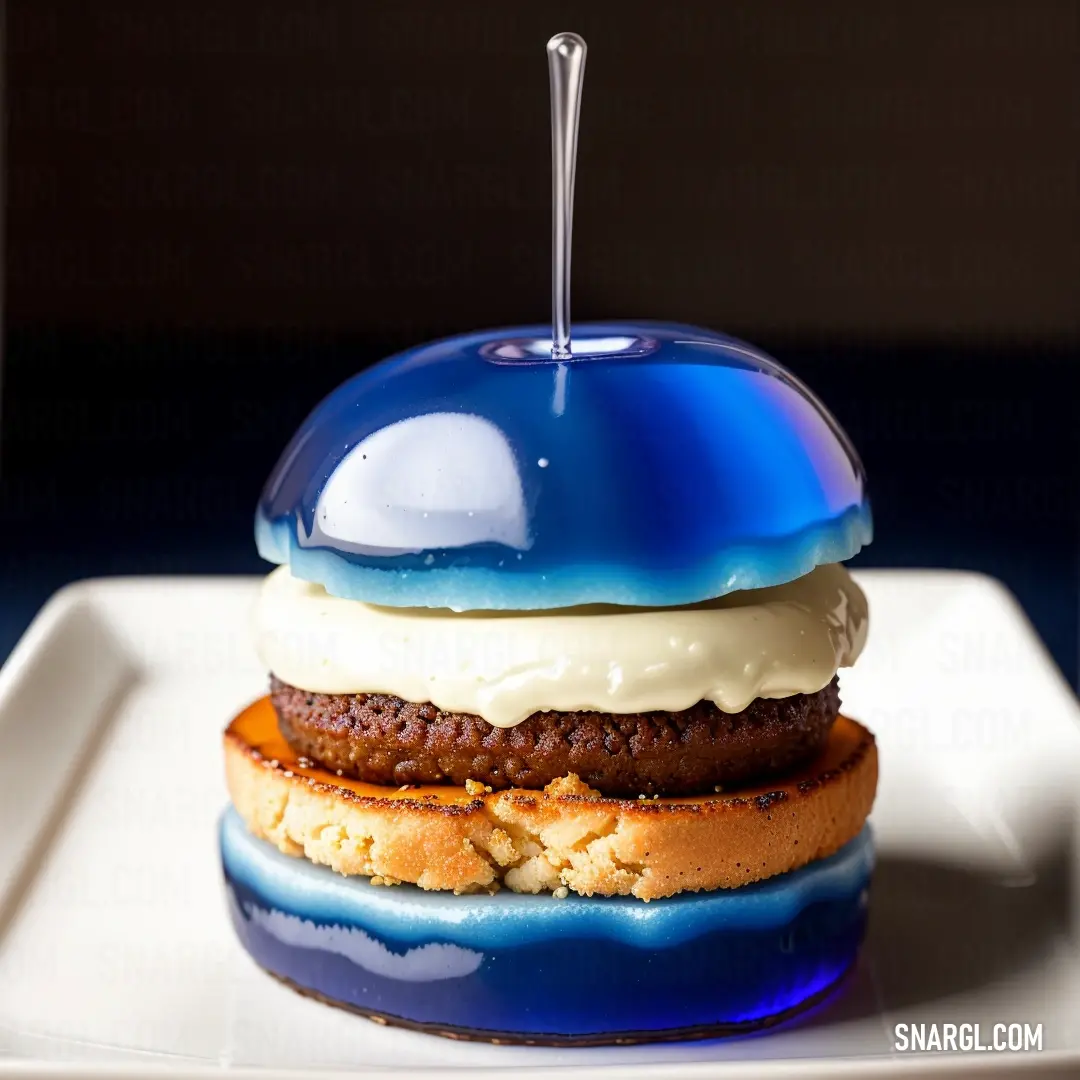 Ultramarine color. Blue apple sandwich on a white plate with a spoon in it's mouth and a chocolate cookie in the middle