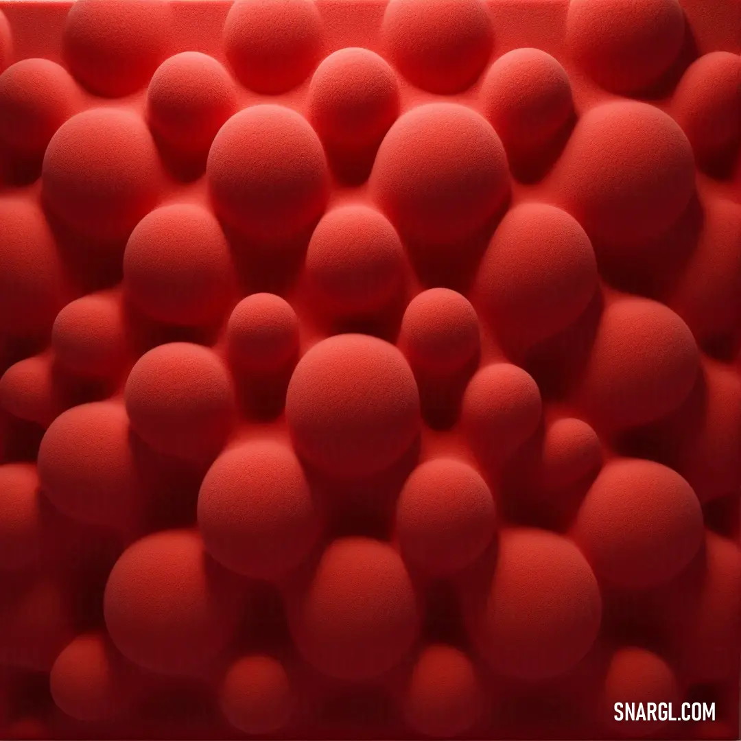 Red object with many balls in it's center and a white background. Example of CMYK 0,82,76,32 color.