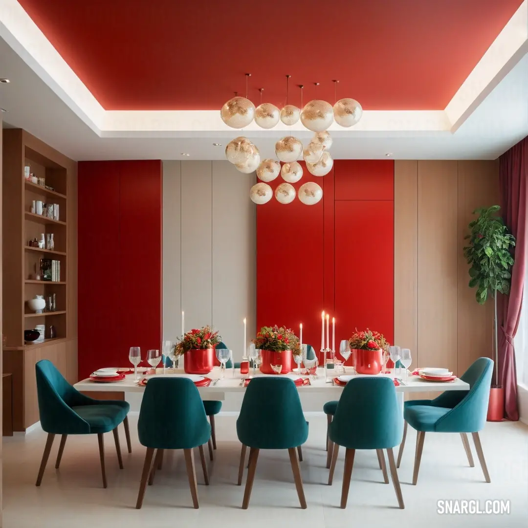 Dining room with a red wall and a white table with blue chairs and a red wall. Example of #990000 color.