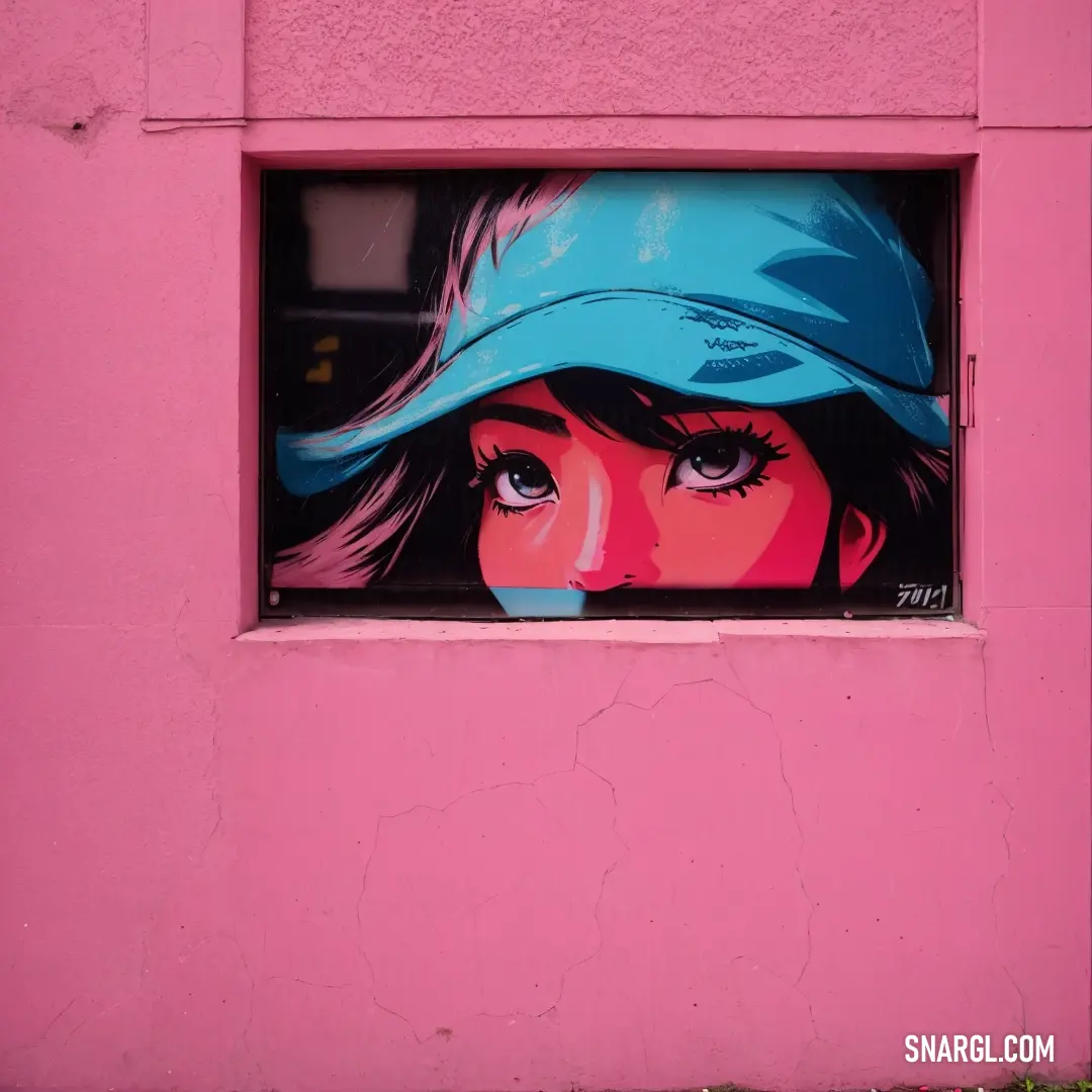 Pink wall with a painting of a woman's face in a blue hat on it's side