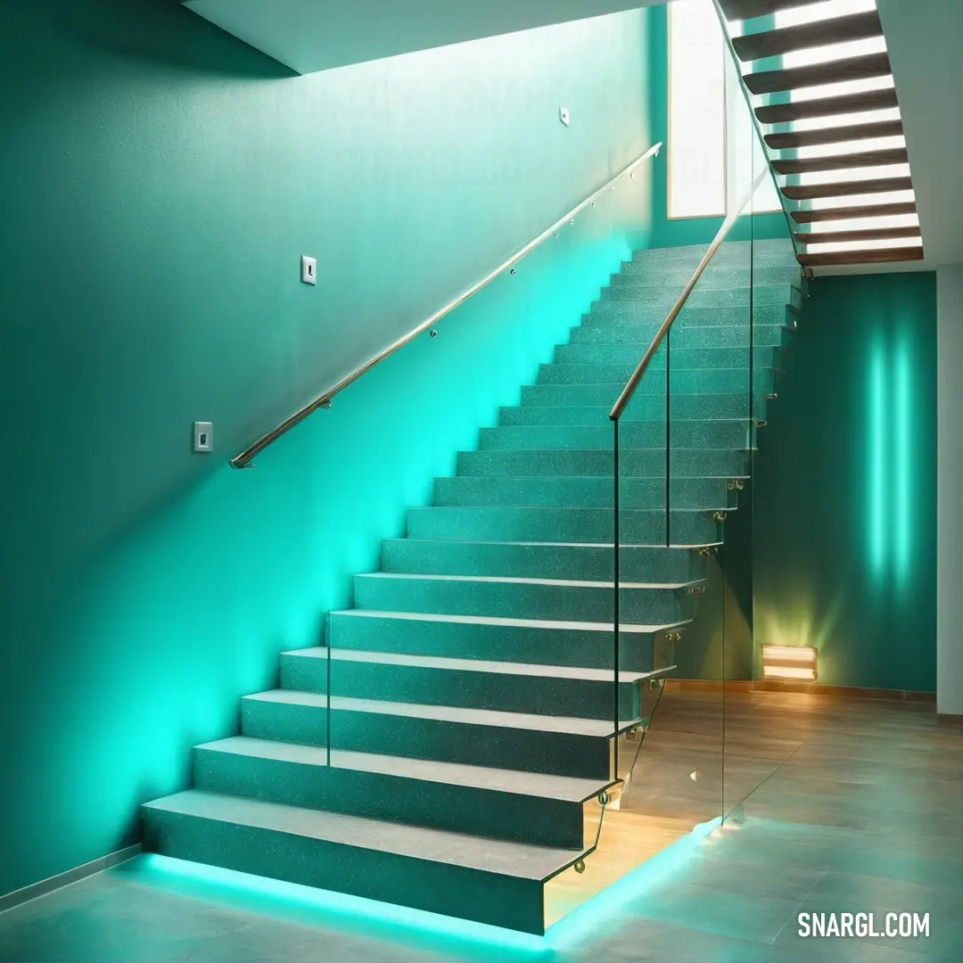 Staircase with a green wall and a white stair case with a light on it. Example of Verdigris color.