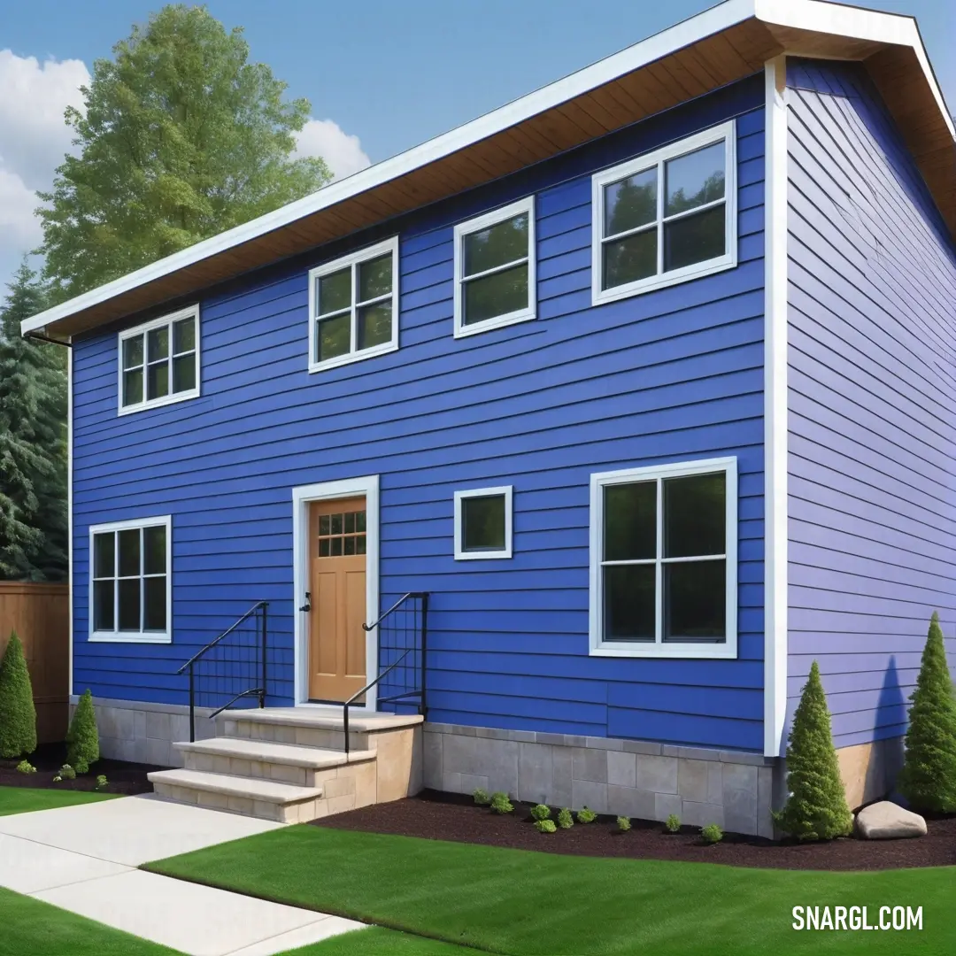 Blue house with a brown door and steps leading to it and a green yard with trees and bushes. Example of Violet Blue color.