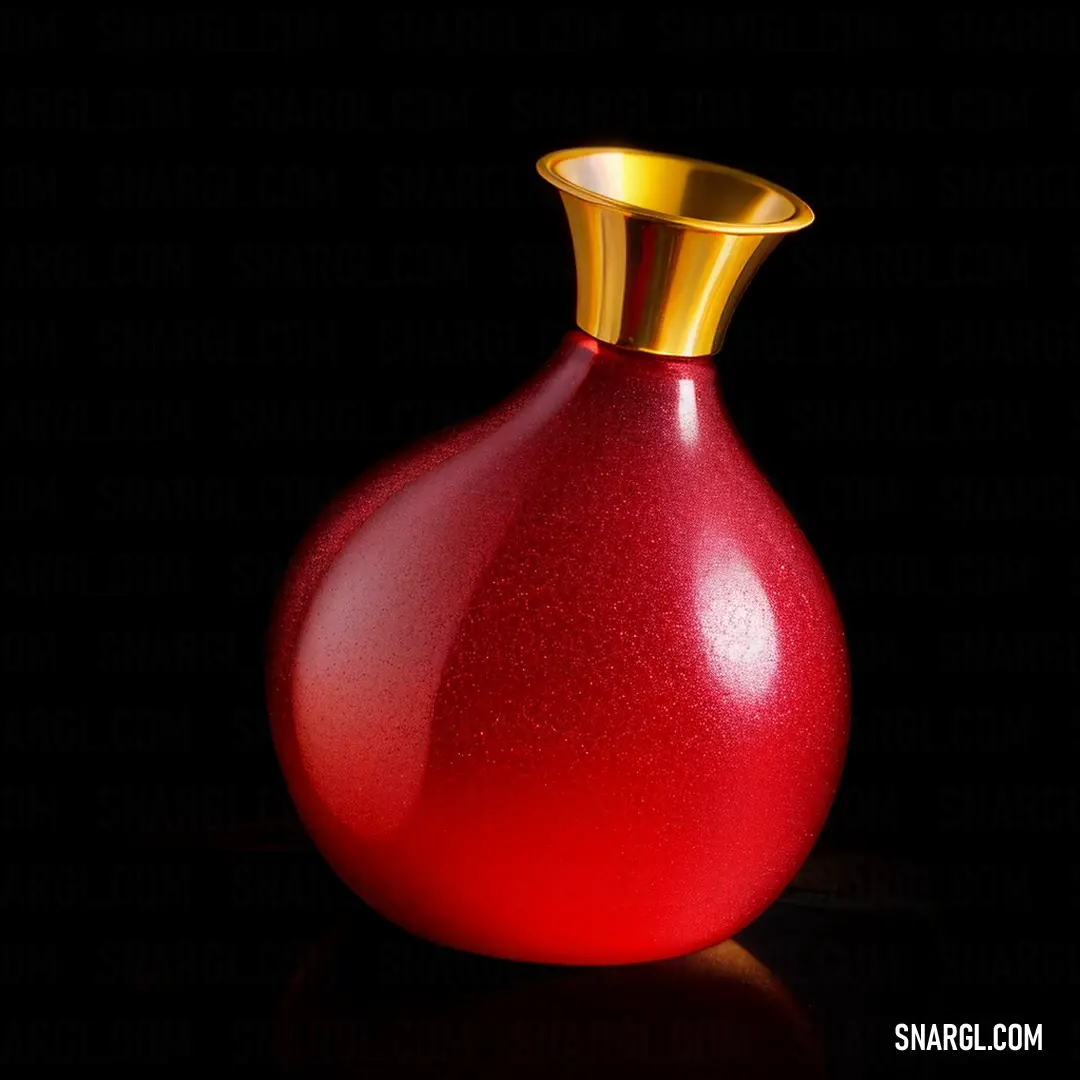 Red vase with a gold top on a black surface with a reflection of the vase on the floor