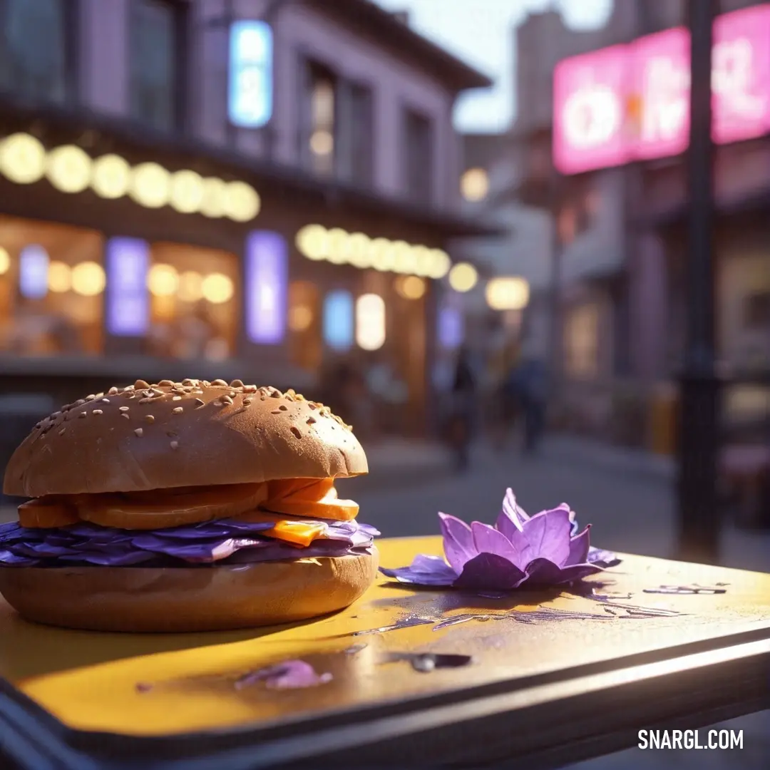 Wisteria color. Hamburger on top of a table next to a purple flower on a table top in front of a store