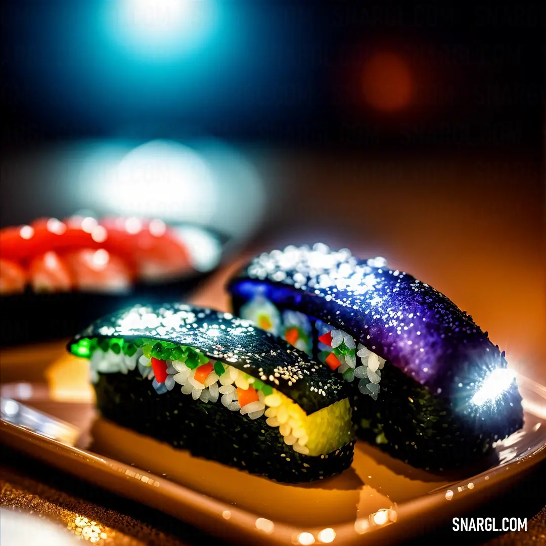 Plate with some colorful sushi on it and a bowl of other sushi in the background on a table