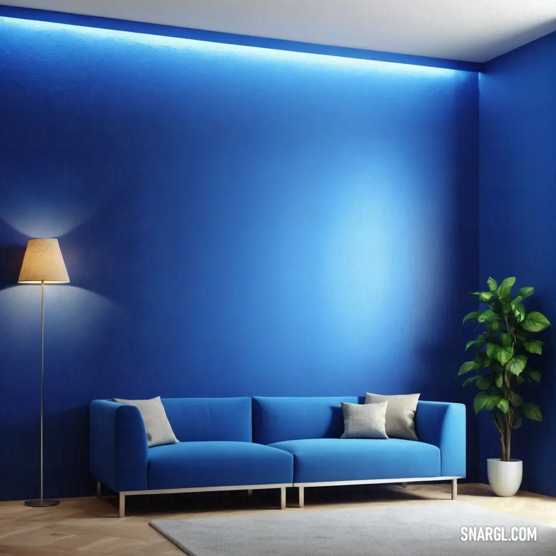 Blue couch in a room with a lamp on the wall and a rug on the floor in front of it. Color #0F4D92.