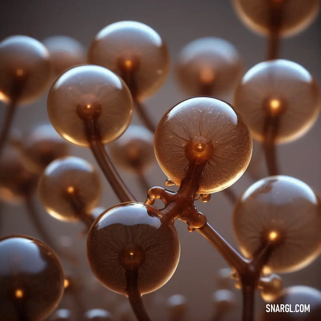 Close up of a bunch of balls on a plant stem with water droplets on it's surface. Color CMYK 0,50,82,83.