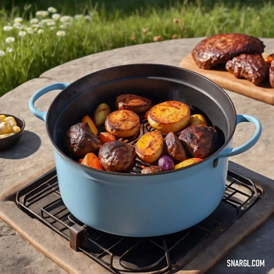 Pot of food on a table next to a cutting board with a knife. Example of CMYK 0,50,82,83 color.